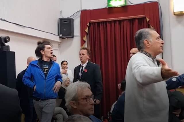 The heckler being removed from People’s Question Time in Woodford Green. Photo: LondonWorld