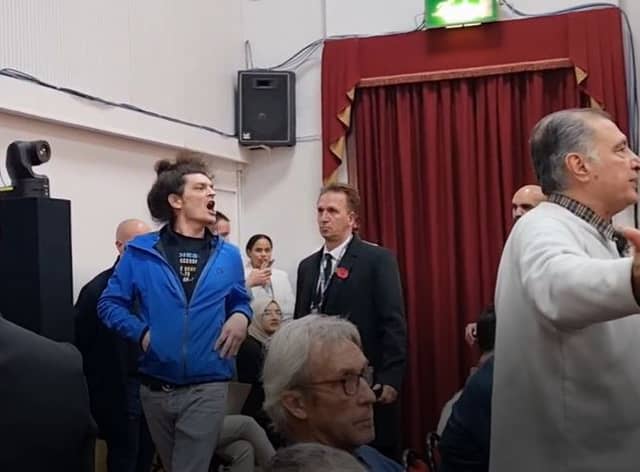 The heckler being removed from People’s Question Time in Woodford Green. Photo: LondonWorld