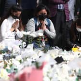 People pay tribute to the victims of the Halloween celebration stampede, November 01, 2022 in Seoul, South Korea.