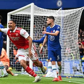 Arsenal's French defender William Saliba (C) celebrates after Arsenal's Brazilian defender Gabriel Magalhaes (Photo by GLYN KIRK/AFP via Getty Images)