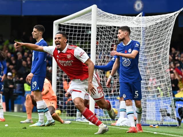 Arsenal's French defender William Saliba (C) celebrates after Arsenal's Brazilian defender Gabriel Magalhaes (Photo by GLYN KIRK/AFP via Getty Images)