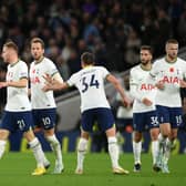 Harry Kane of Tottenham Hotspur celebrates with teammates after scoring their team’s first goal  during the Premier League match Photo by Mike Hewitt/Getty Images)