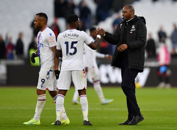 <p> Patrick Vieira celebrates with Jeffrey Schlupp of Crystal Palace after their sides victory during the Premier League match  (Photo by Tom Dulat/Getty Images)</p>