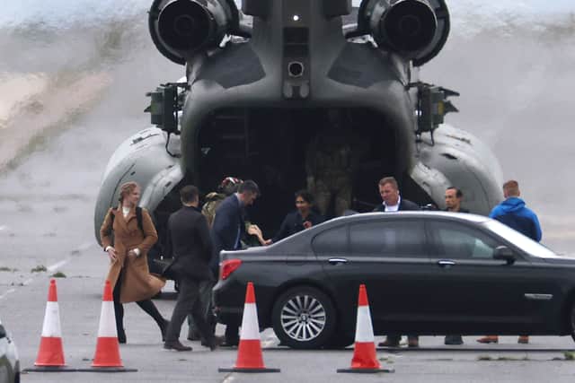 Home Secretary Suella Braverman arrives by helicopter at the migrant processing facility at Manston Airfield. Photo: Getty