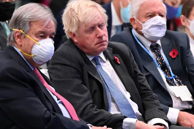 Boris Johnson at COP26 next to Sir David Attenborough