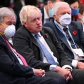 Boris Johnson apparently asleep next to Sir David Attenborough at COP26.