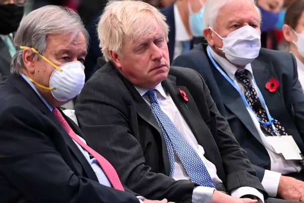 Boris Johnson apparently asleep next to Sir David Attenborough at COP26.
