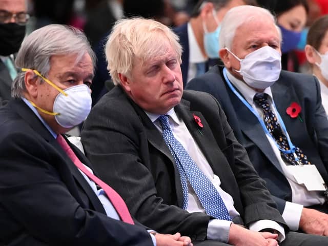 Boris Johnson apparently asleep next to Sir David Attenborough at COP26.