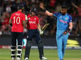 Alex Hales of England congratulates  Jos Buttler of England on his 50th run during the ICC Men's T20 World Cup Semi Final match between India and England at Adelaide Oval on November 10