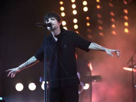 One Direction singer Louis Tomlinson reschedules in-store signing after breaking arm