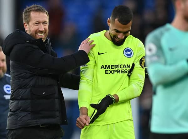  Graham Potter (L) celebrates with Brighton’s Spanish goalkeeper Robert Sanchez (R)  (Photo by PAUL ELLIS/AFP via Getty Images)