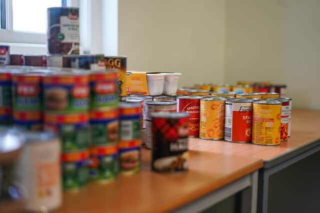Donated tins of soup and spaghetti hoops inside a food bank. Photo: Getty
