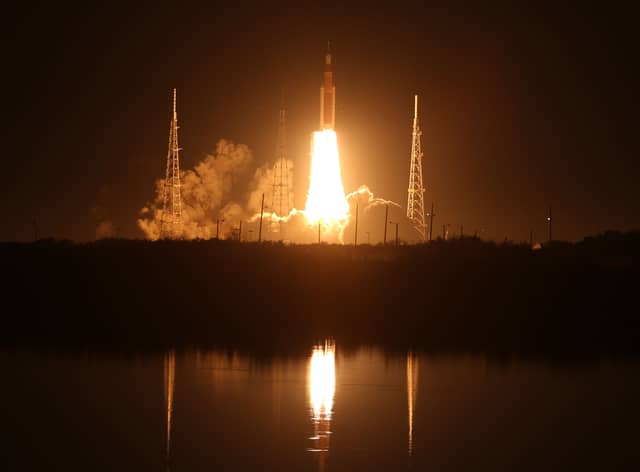 Artemis I Space Launch System (SLS) rocket, with the Orion capsule attached, launches at NASA's Kennedy Space Center on November 16