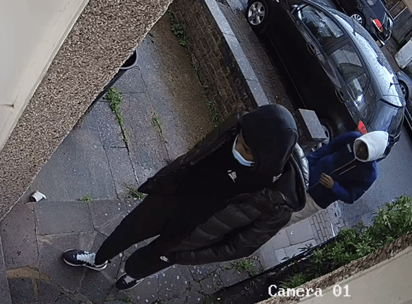 Police are searching for these two men after a woman was attacked at knifepoint in her home in Wandsworth. Credit: Met Police