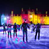 Skaters take to the ice at night at the ice rink at Hampton Court