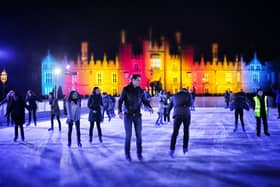 Skaters take to the ice at night at the ice rink at Hampton Court