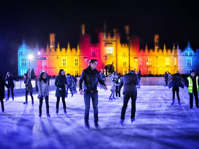 Skaters take to the ice at night at the ice rink at Hampton Court