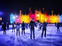 Skaters take to the ice at night at the ice rink at Hampton Court