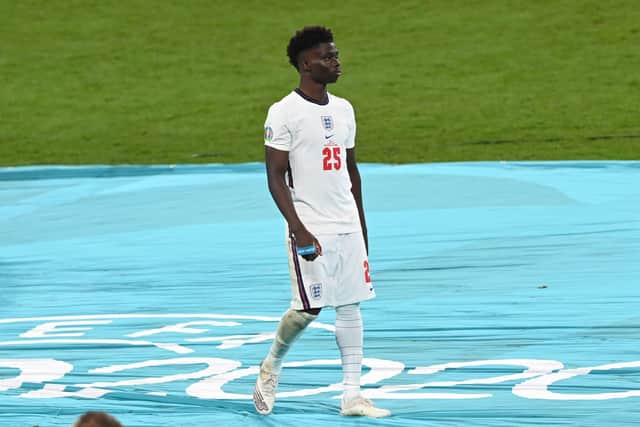 Bukayo Saka of England looks dejected after receiving his runners up medal following defeat in the UEFA Euro 2020 Championship  (Photo by Facundo Arrizabalaga - Pool/Getty Images)