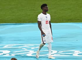 Bukayo Saka of England looks dejected after receiving his runners up medal following defeat in the UEFA Euro 2020 Championship  (Photo by Facundo Arrizabalaga - Pool/Getty Images)