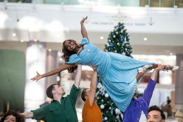 Oti Mabuse creats a flashmob for Disenchanted at Westfield Shopping centre. Photo: SWNS