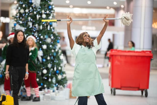 Starting off as an unsuspecting barista in the shopping centre, Oti was shortly joined by undercover security guards. Photo: SWNS