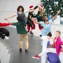 Performing a three-minute routine, Christmas shoppers and commuters were left captivated by the impromptu dance. Photo: SWNS