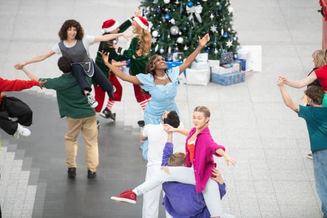 Performing a three-minute routine, Christmas shoppers and commuters were left captivated by the impromptu dance. Photo: SWNS