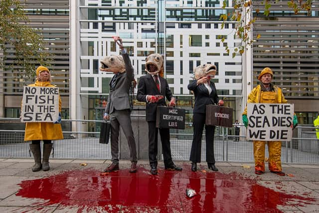 Performers from Ocean Rebellion outside Defra offices. Credit: Ocean Rebellion