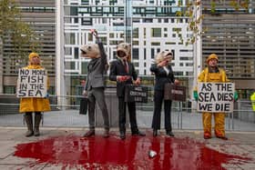 Performers from Ocean Rebellion outside Defra offices. Credit: Ocean Rebellion