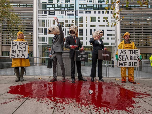 Performers from Ocean Rebellion outside Defra offices. Credit: Ocean Rebellion