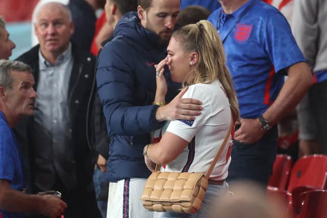 England's Harry Kane consoles his wife Katie after Italy won the UEFA EURO 2020 final at the Wembley Stadium on July 11, 2021. (Photo by CARL RECINE/POOL/AFP via Getty Images)