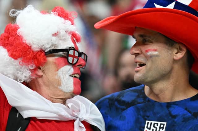 An England and a USA supporter during the World Cup clash in Qatar.