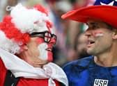 An England and a USA supporter during the World Cup clash in Qatar.