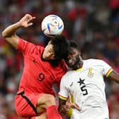 Guesung Cho of Korea Republic competes for a header against Thomas Partey. Credit: Claudio Villa/Getty Images