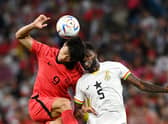 Guesung Cho of Korea Republic competes for a header against Thomas Partey. Credit: Claudio Villa/Getty Images