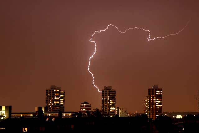 Lightning flashes in the night sky over South London August 07, 2008 