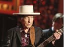 Bob Dylan has issued a rare public apology for selling books with automated signatures.  