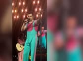 Video footage shows Harry Styles asking the crowd to move back slowly to stop fans being crushed against the handrails.
