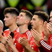 Wales’ forward Gareth Bale and teammates applaud Wales supporters after their defeat against England (Photo by NICOLAS TUCAT/AFP via Getty Images)