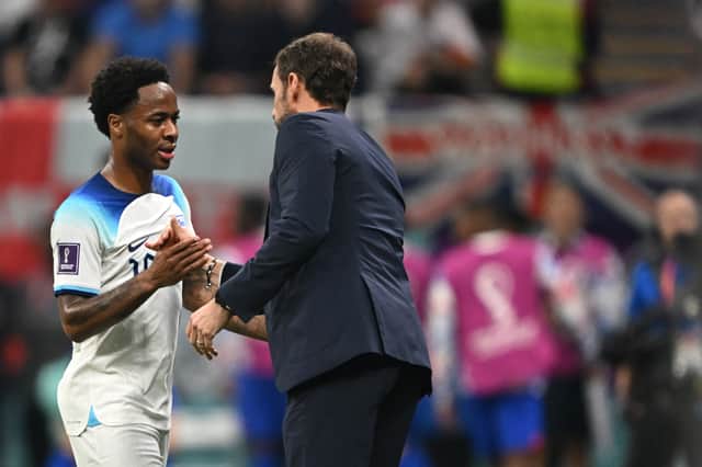 Sterling shakes hands with England manager Gareth Southgate during the World Cup.  