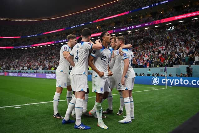 ude Bellingham of England celebrates the goal of Jordan Henderson of England during the FIFA World Cup Qatar 2022 Round of 16 match between England and Senegal at Al Bayt Stadium on December 04, 2022 in Al Khor, Qatar. (Photo by Dan Mullan/Getty Images)
