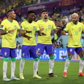 Vinicius Junior of Brazil celebrates with Raphinha, Lucas Paqueta and Neymar after scoring the team’s first goal during the (Photo by Michael Steele/Getty Images)