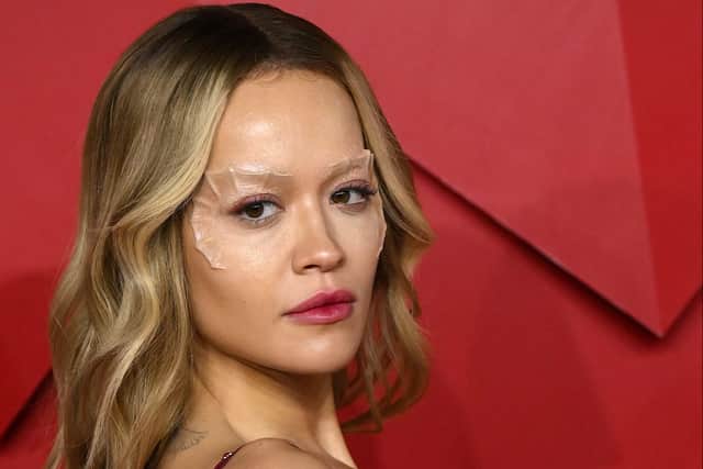 British singer songwriter Rita Ora poses on the red carpet upon arrival at The 2022 Fashion Awards in London on December 5, 2022. (Photo by Daniel LEAL / AFP)