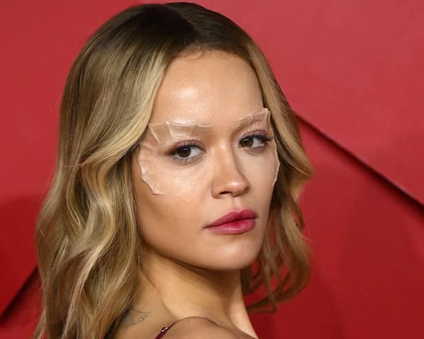 British singer songwriter Rita Ora poses on the red carpet upon arrival at The 2022 Fashion Awards in London on December 5, 2022.  (Photo by Daniel LEAL / AFP) 