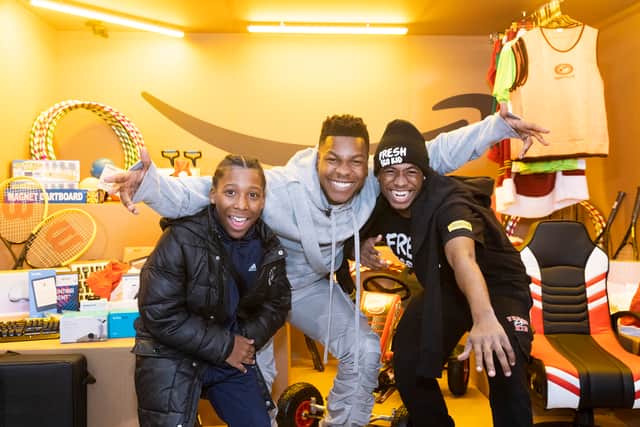 John Boyega meets kids at a youth centre in Croydon. Credit: SWNS