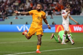 Memphis Depay of Netherlands celebrates scoring the first goal during the Round of 16 win against USA (Photo by Julian Finney/Getty Images)