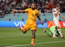 Memphis Depay of Netherlands celebrates scoring the first goal during the Round of 16 win against USA (Photo by Julian Finney/Getty Images)