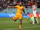 Memphis Depay of Netherlands celebrates scoring the first goal during the Round of 16 win against USA (Photo by Julian Finney/Getty Images)