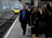 Passengers wait to board an Avanti West Coast mainline train at Crewe Station on December 01, 2022 in Crewe, England. The Rail, Maritime and Transport workers union (RMT) said its members will strike on eight days - December 13, 14, 16 and 17, and January 3, 4, 6 and 7 - the latest episode in a dispute over pay and working practices. (Photo by Christopher Furlong/Getty Images)